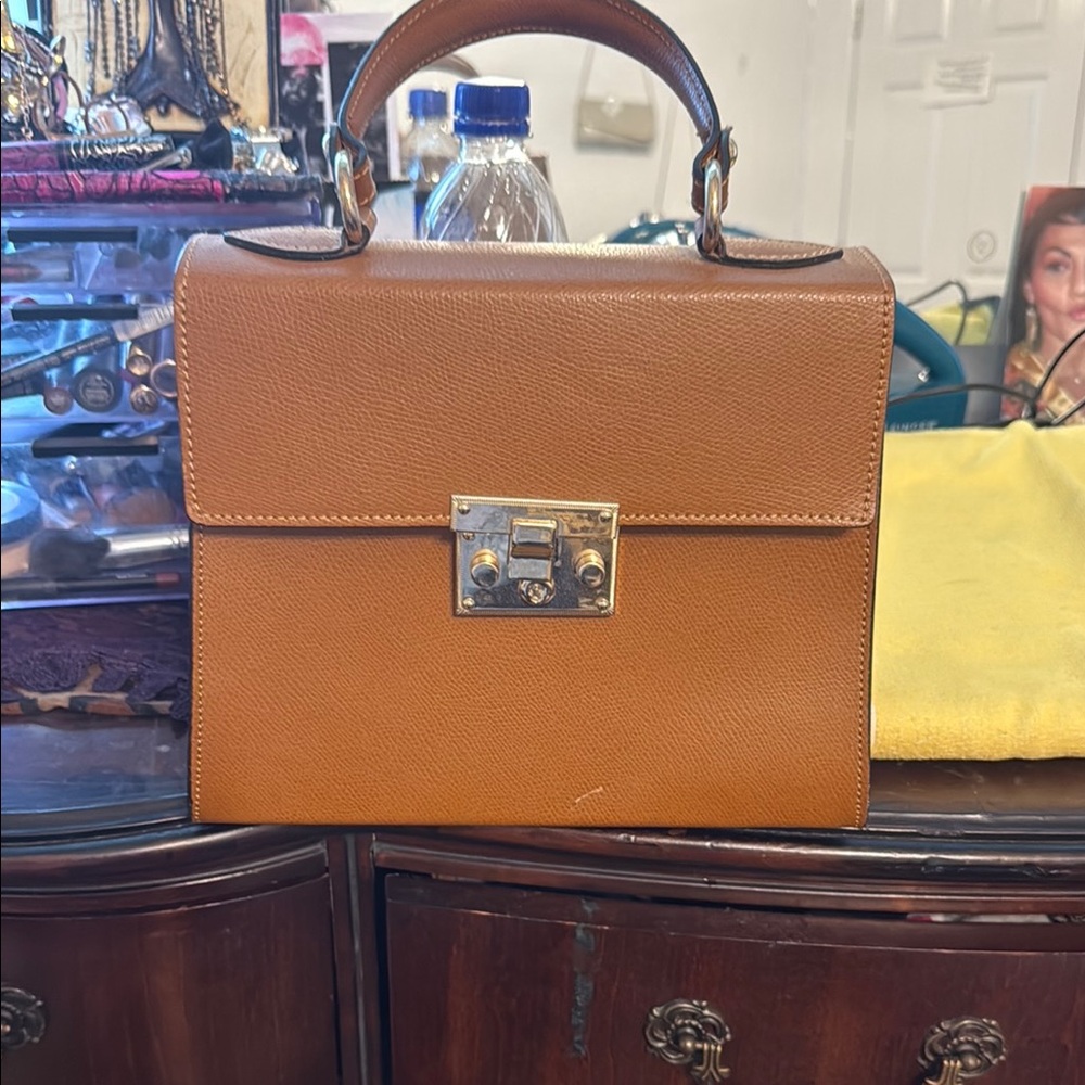 Tan Leather Satchel with Structured Design and Silver Hardware